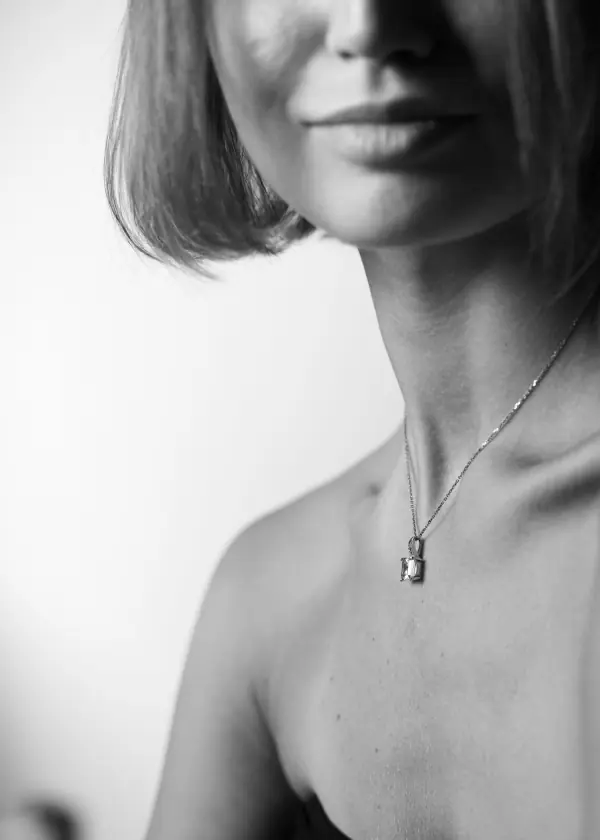 Black and white portrait with lock necklace