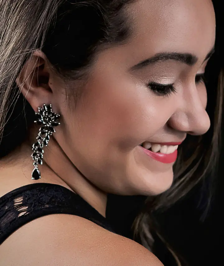 Smiling woman with silver earrings
