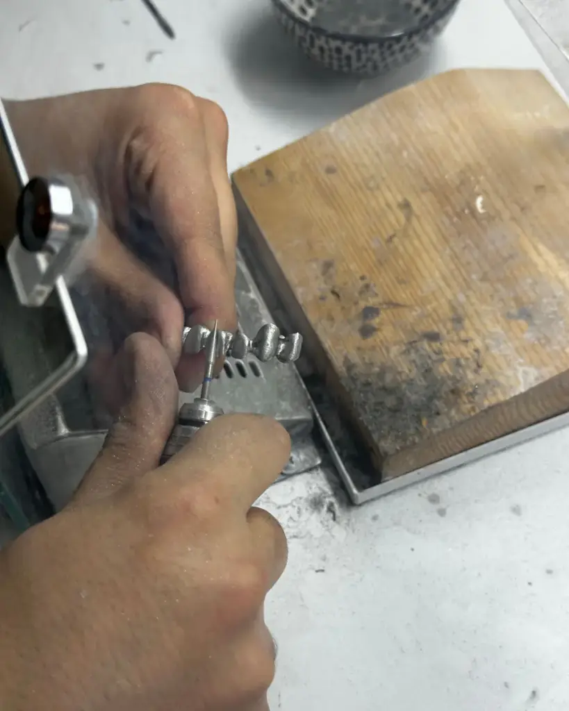 Jeweler crafting a silver ring